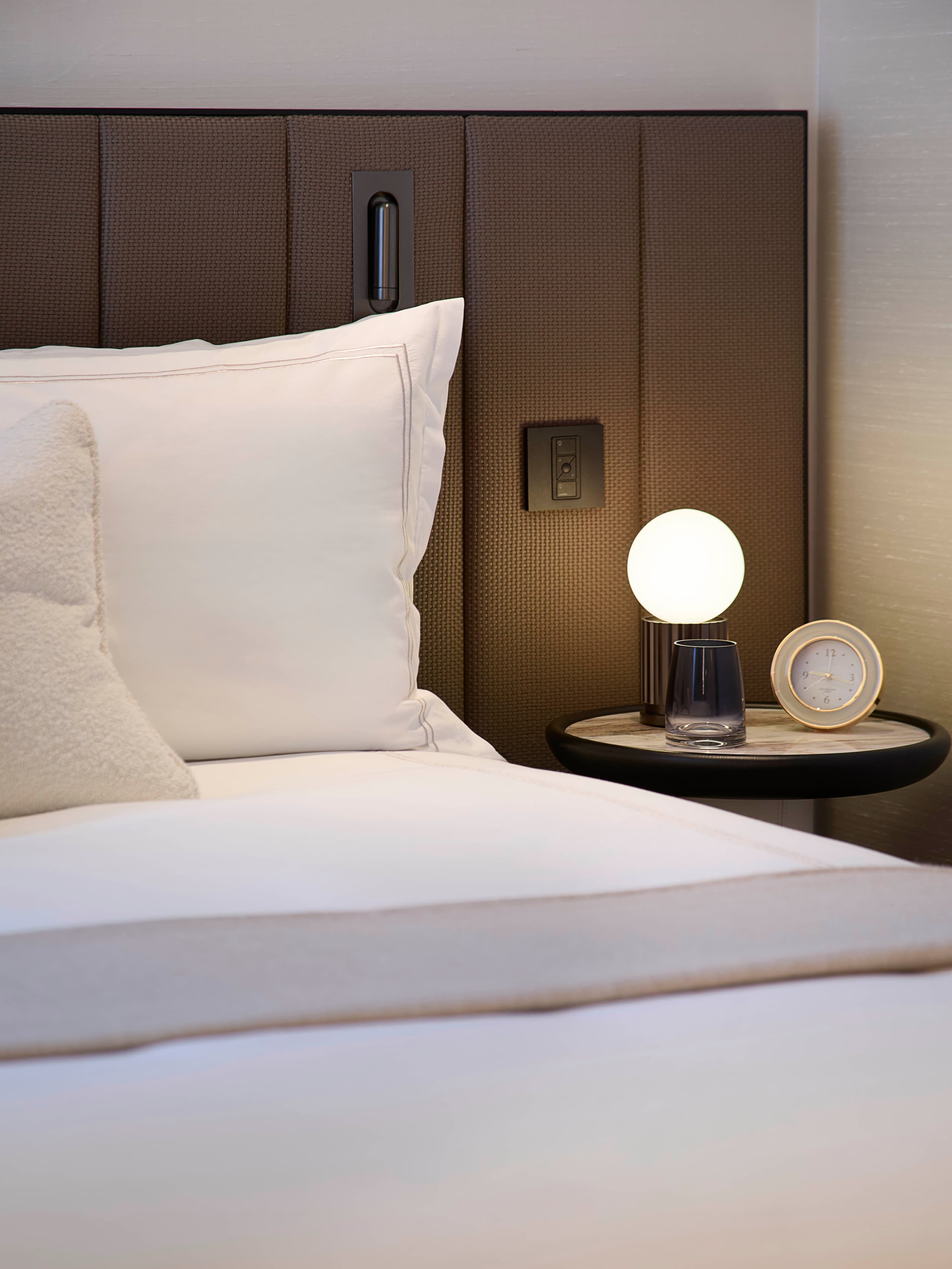 Bedroom detail with designer lighting