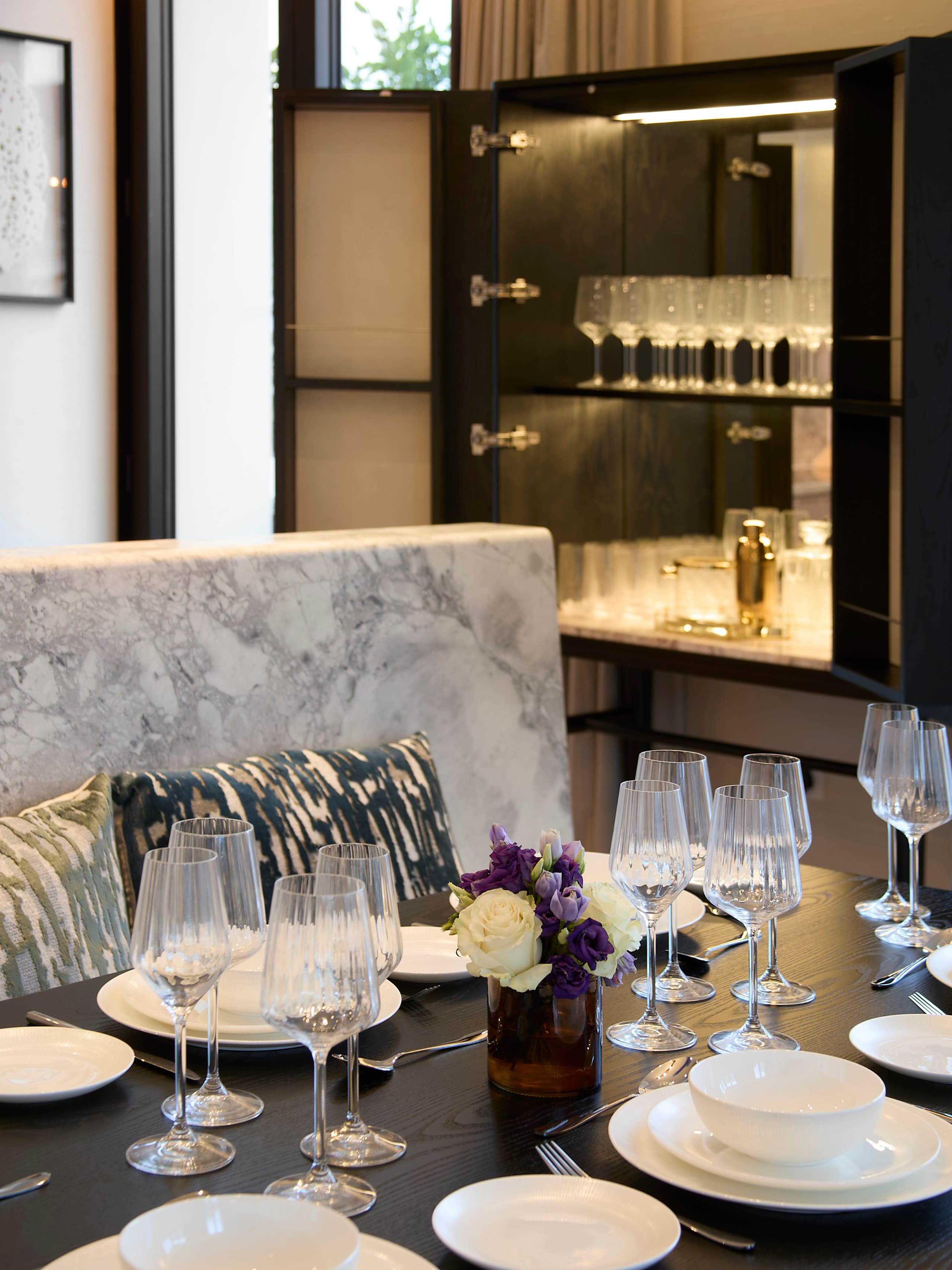 Dining area with marble and crystal glassware