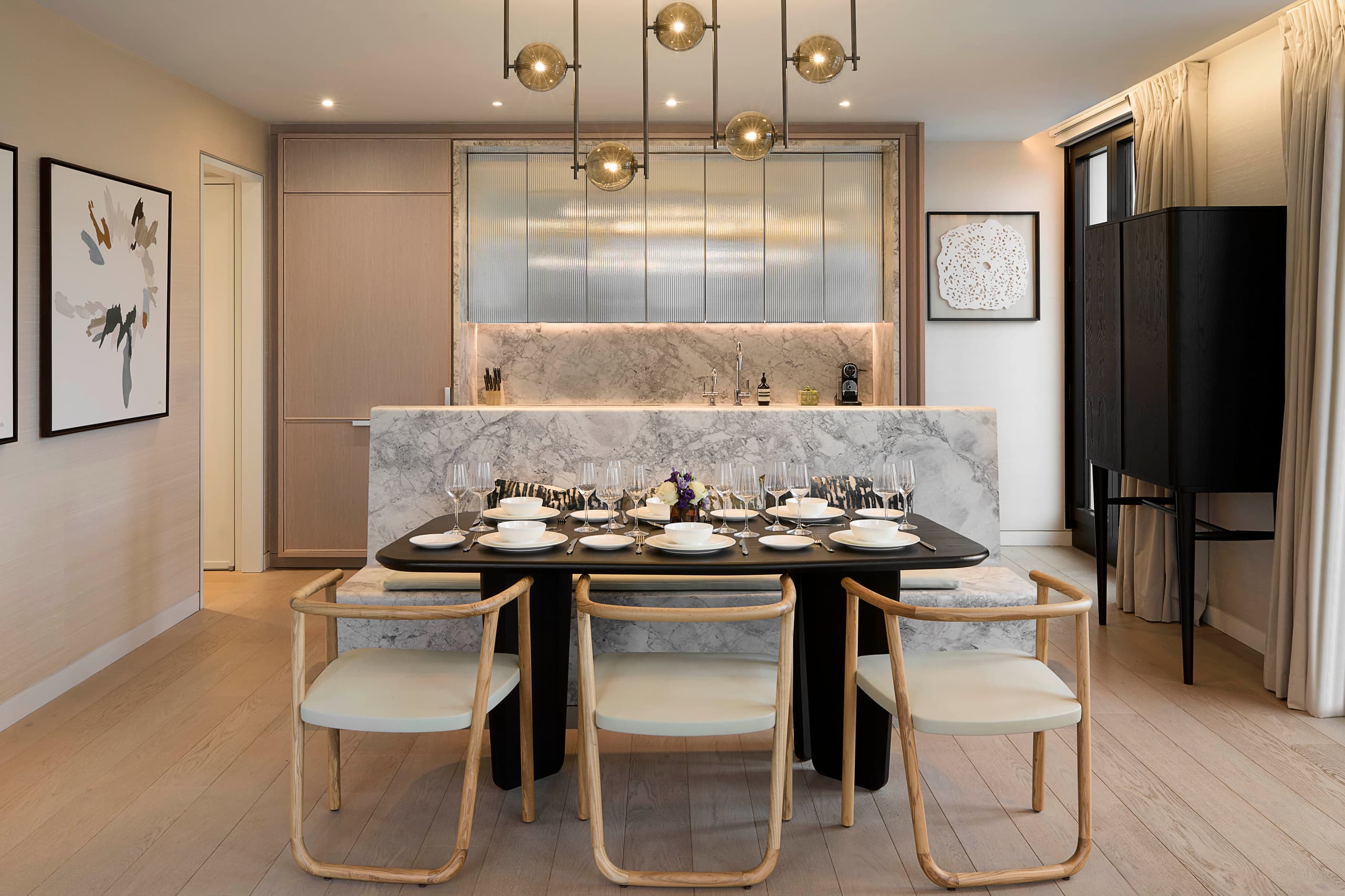 Open-plan living and dining with marble kitchen